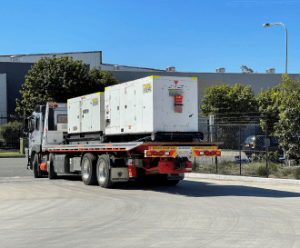 A back view of a truck with generators